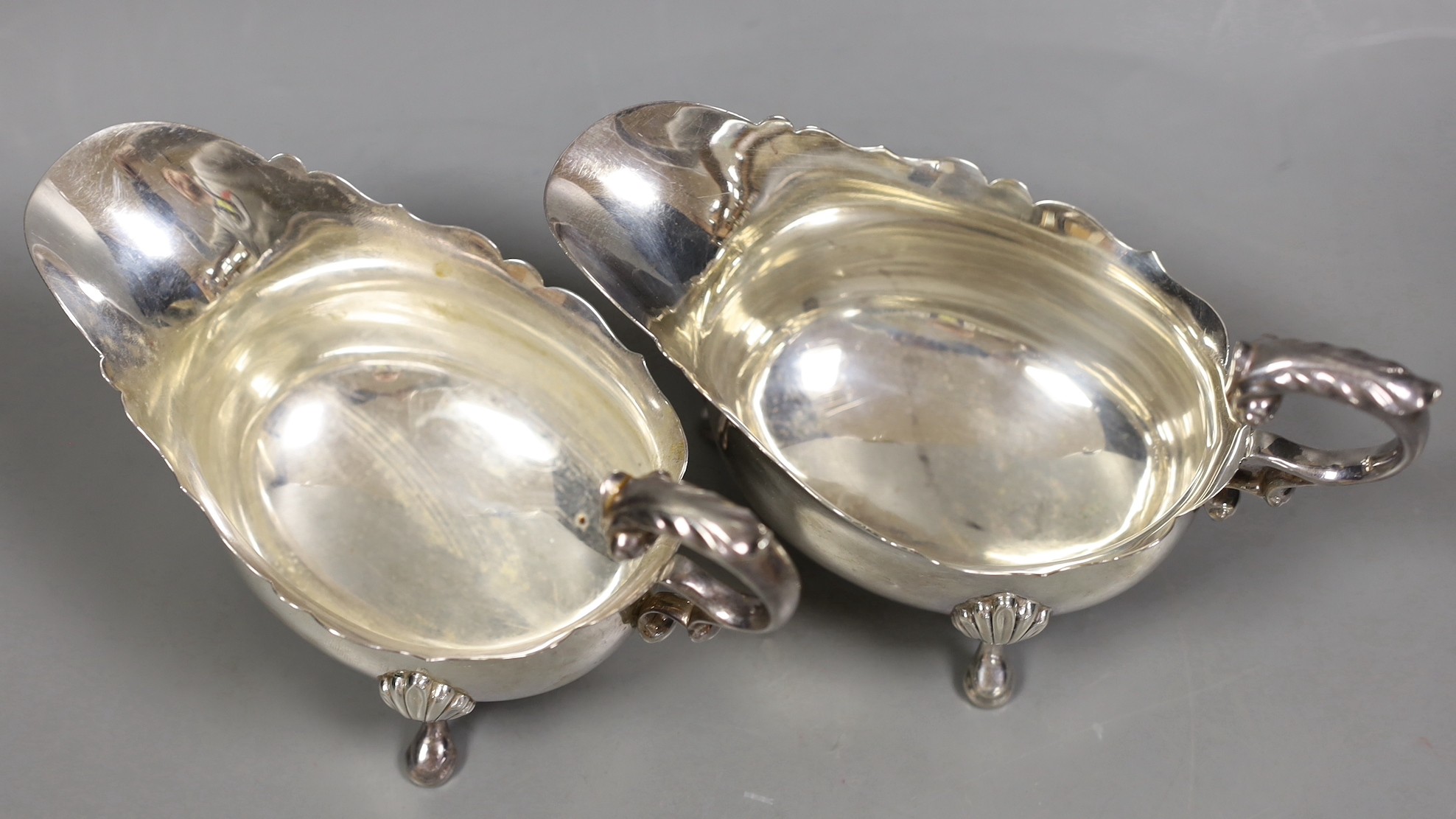 A pair of George V silver oval sauceboats, by Wilson & Gill, London, 1935/6, 15.9oz.